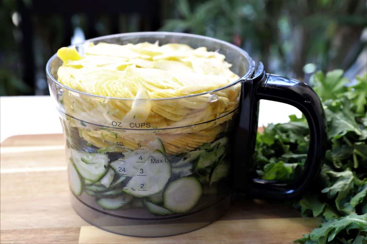 zucchini and yellow squash in a food processor