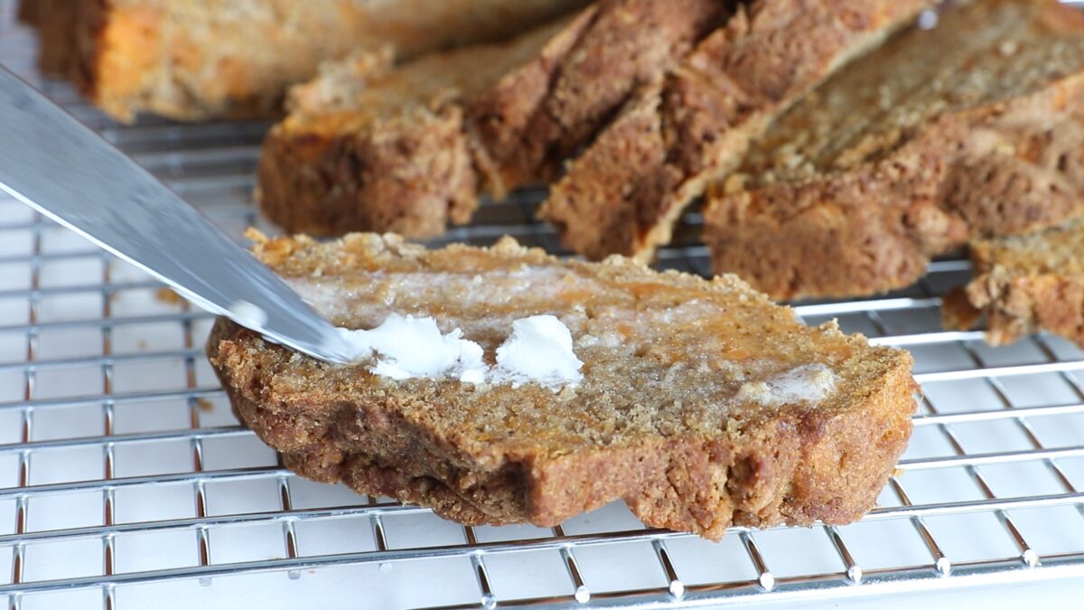 slice of sweet potato bread with butter and knife