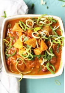 Vegan Pumpkin Chili in a bowl topped with green onions