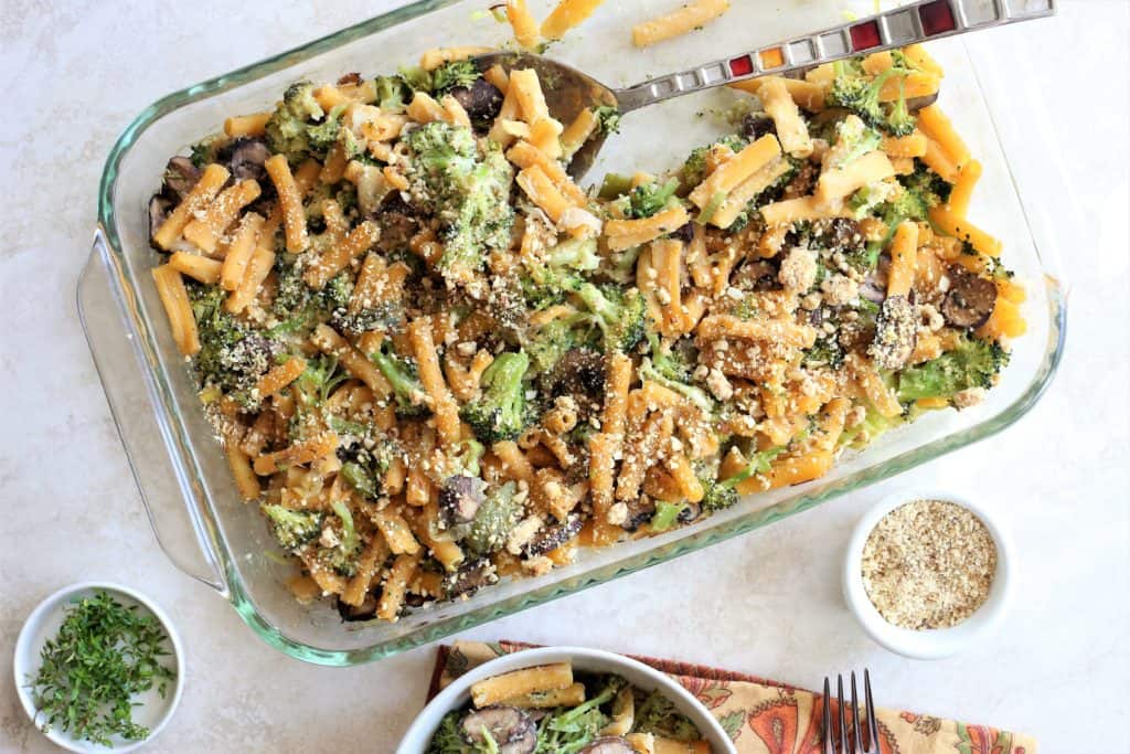 Broccoli Mushroom Tetrazzini in a casserole dish with a large spoon 