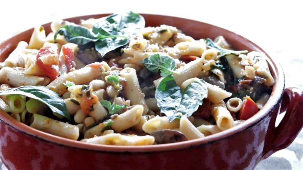 Instant Pot Spinach Mushroom Pasta served in a red dish