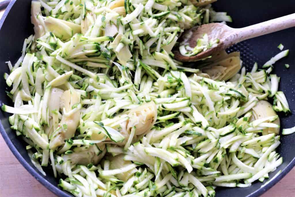 Stirfry zucchini and artichoke hearts