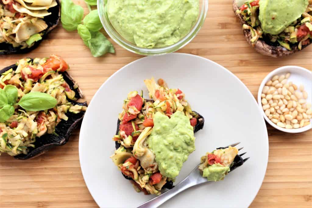 Spoon mixture into portobello mushrooms and top with pesto