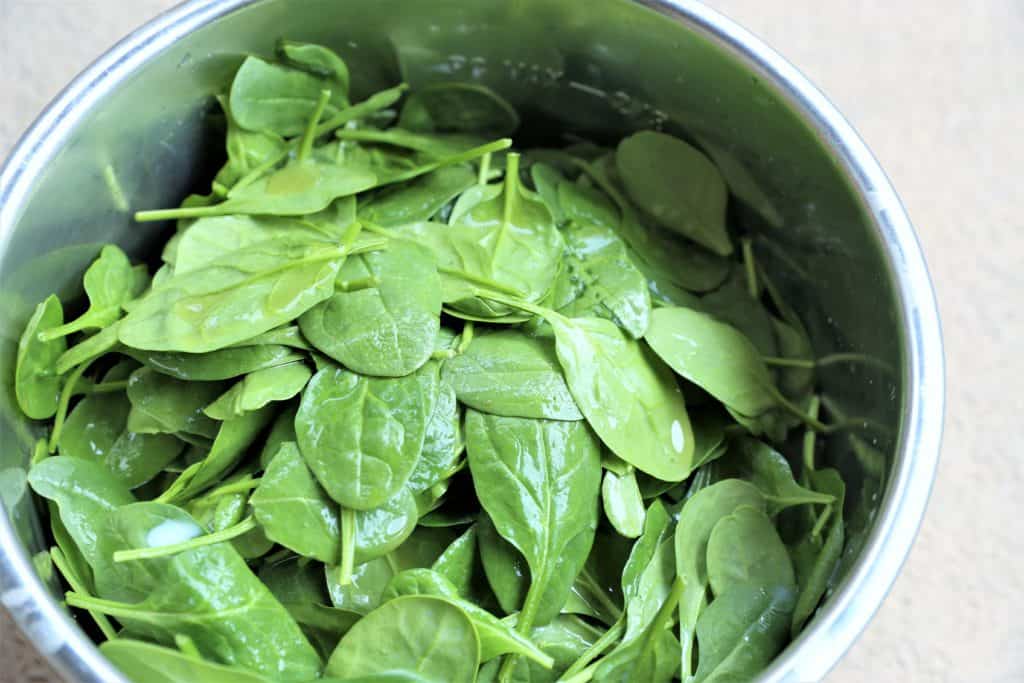 Add spinach and liquids