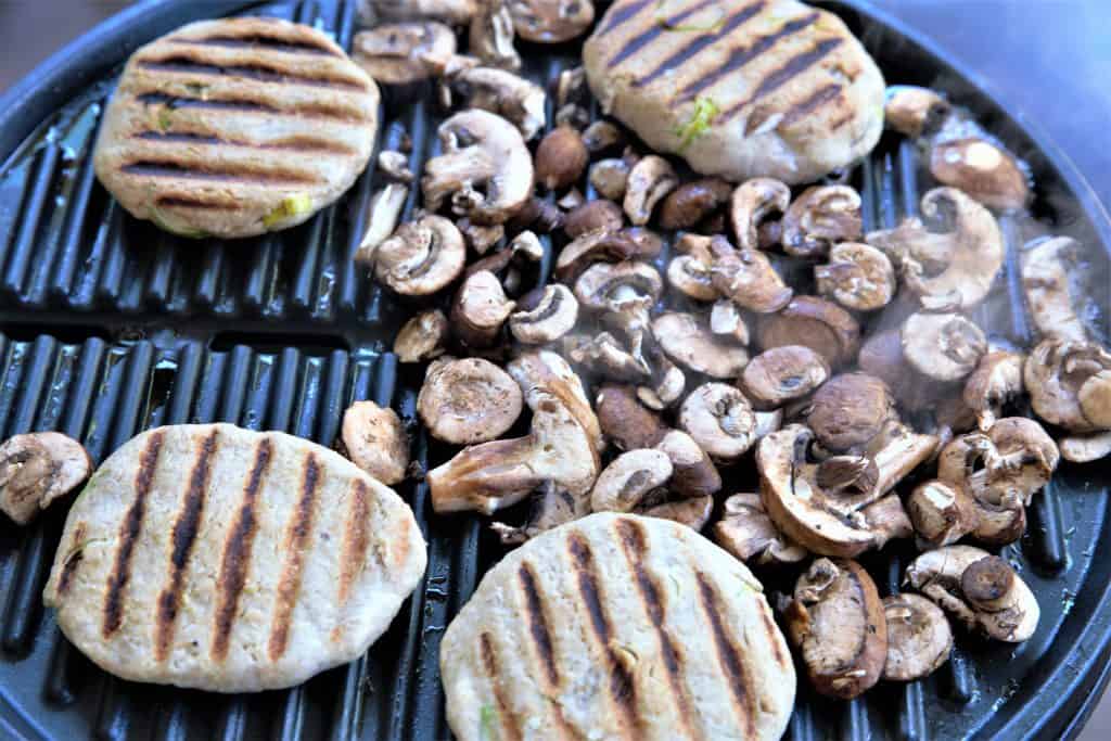 Mushrooms and jackfruit burgers on the grill