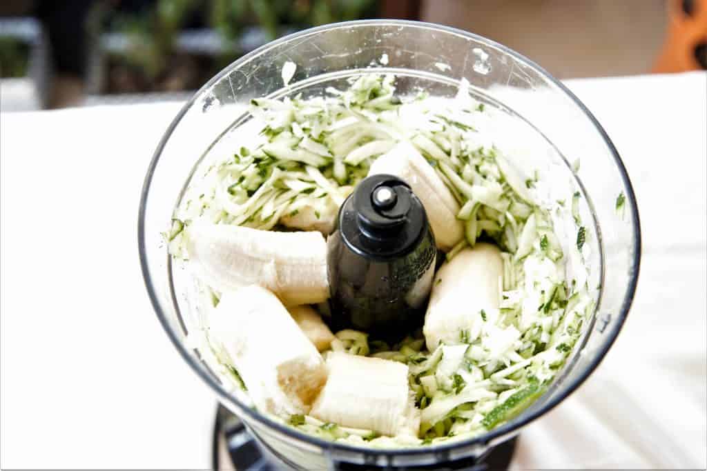 Break up bananas, and add to shredded zucchini in food processor bowl. Mix throughly on low speed.