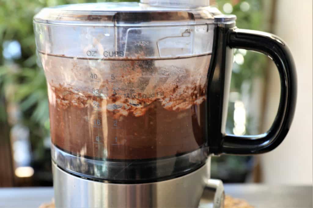 blending chocolate hummus ingredients in a food processor