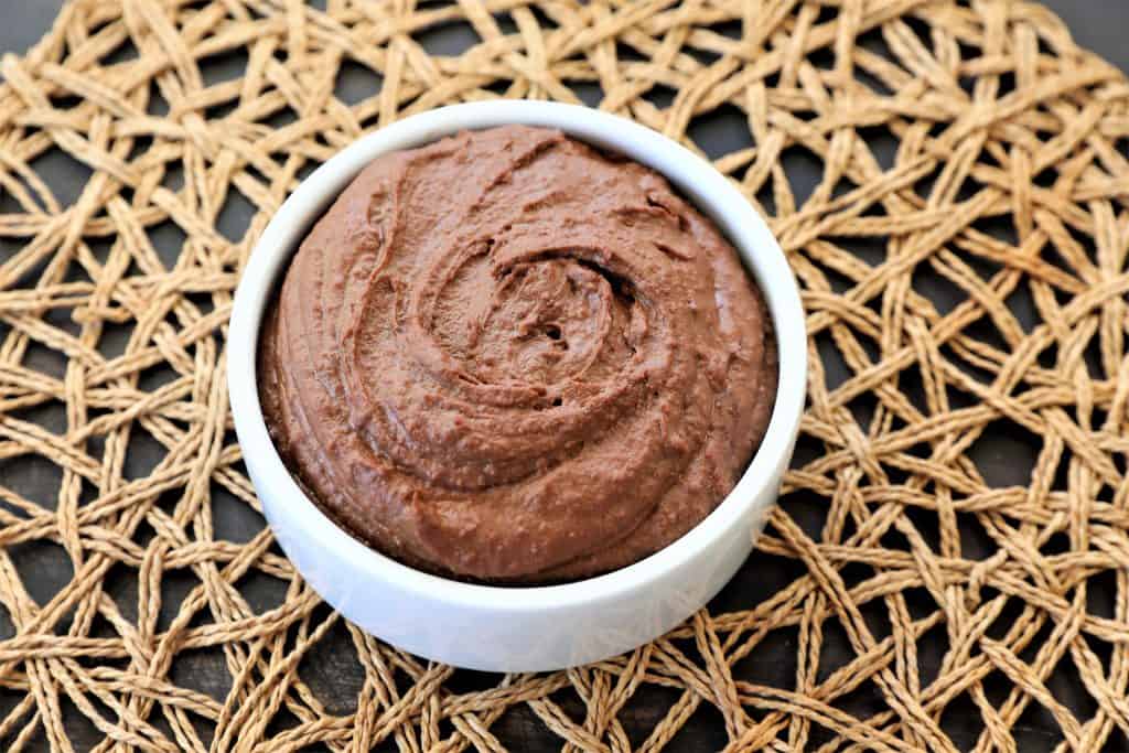 chocolate hummus in a small white bowl 