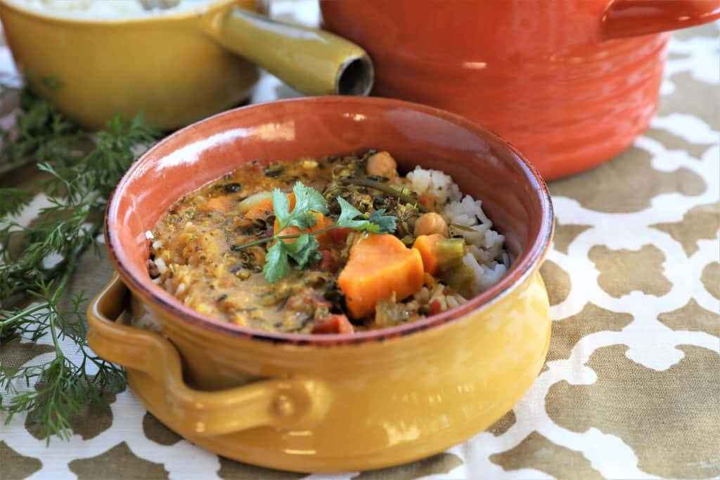 single serving of instant pot vegetable curry in a yellow soup bowl