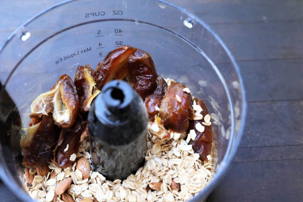 dates, oats, and almonds in a food processor