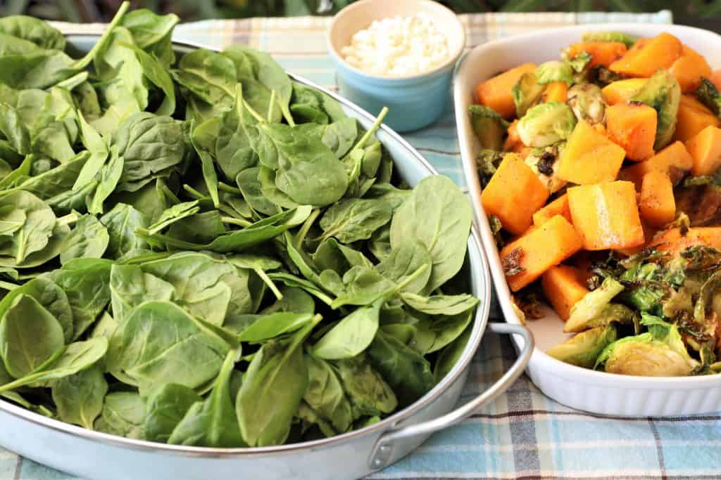 Remove grilled items. Add spinach to large bowl or platter