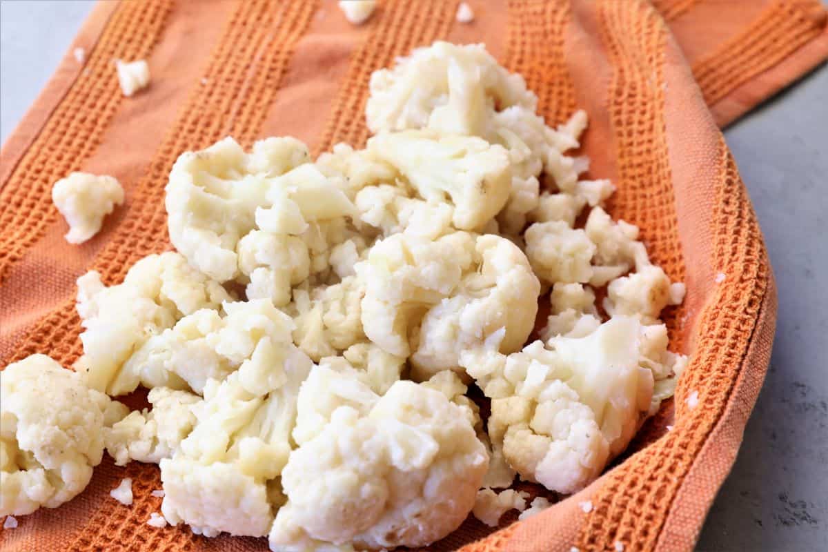 squeezing moisture out of the cooked cauliflower