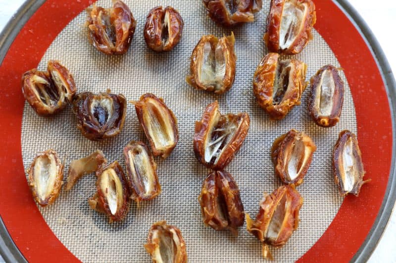 sliced dates on a baking pan