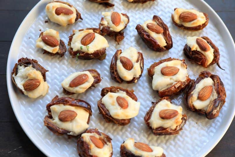 dates stuffed with cream cheese and topped with almonds