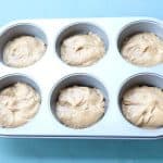 Muffin mix in oiled cupcake pan