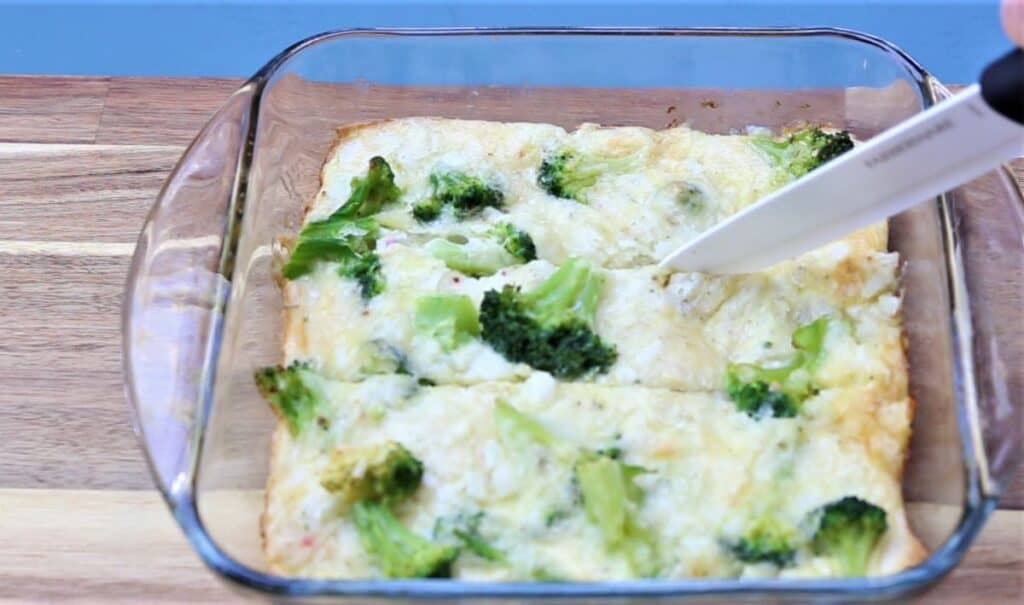 slicing breakfast casserole with knife